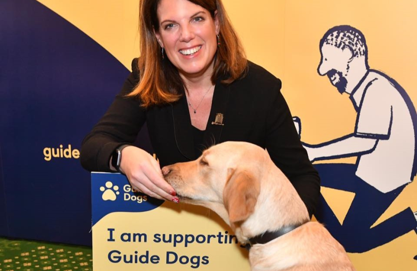 Caroline with an assistance dog at the Guide Dogs UK event in Westminster