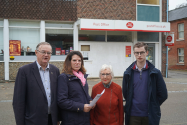 Caroline Nokes outside of the Romsey Post Office, with Cllr David Drew, Joe Dwyer and Mary