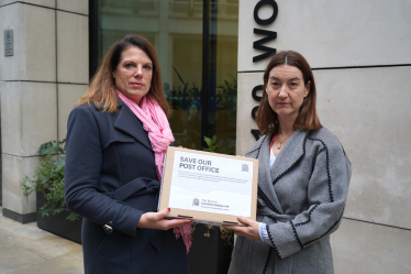 Caroline with a representative of Post Office outside their headquarters in London