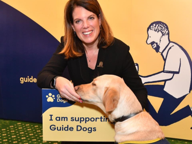 Caroline with an assistance dog at the Guide Dogs UK event in Westminster